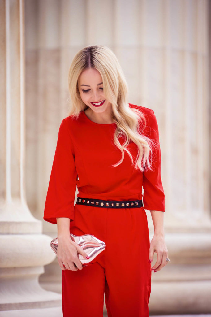 Alena Gidenko of modaprints.com styling an open back red jumpsuit