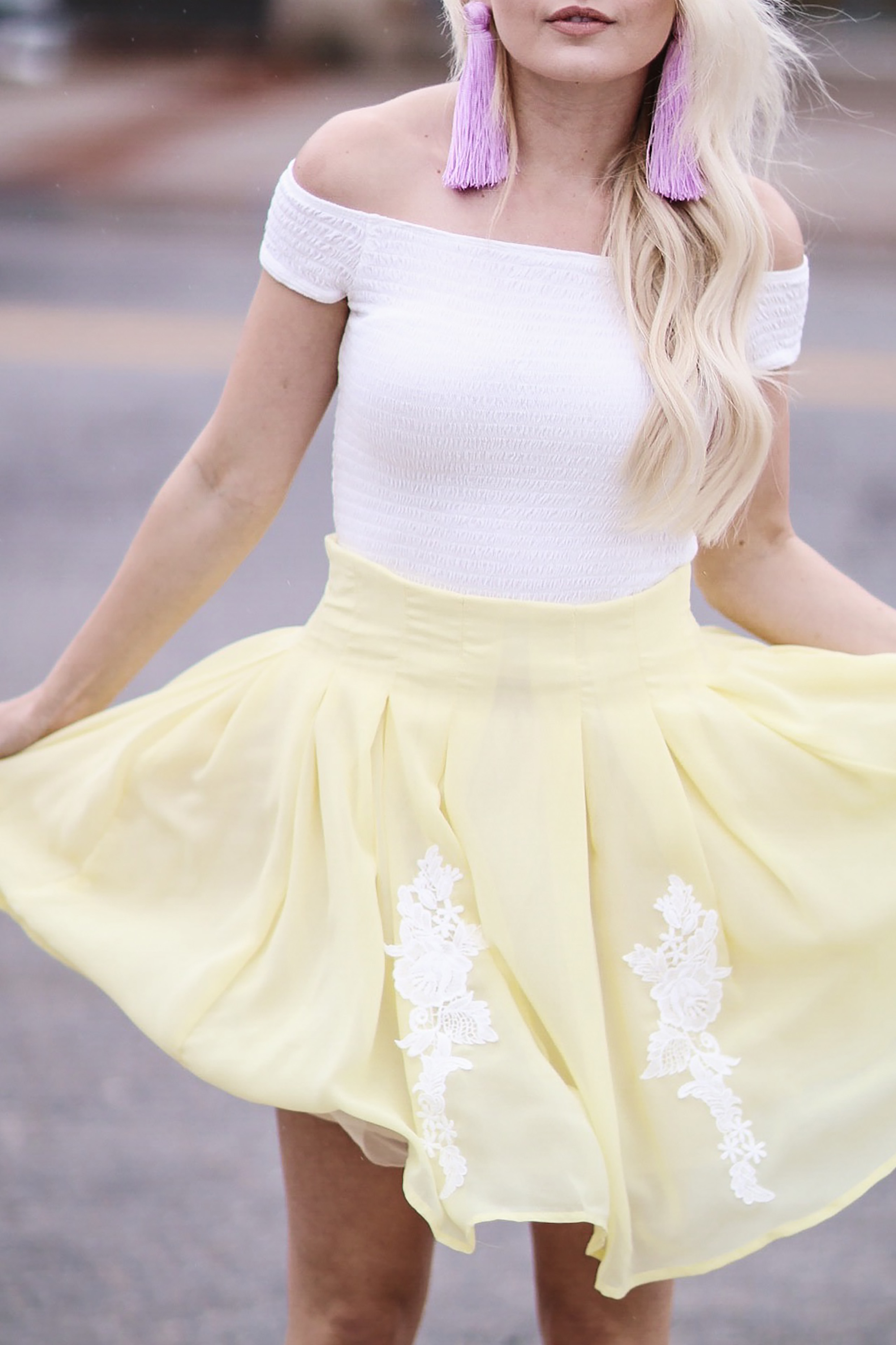 Alena Gidenko from modaprints.com styles a yellow lace skirt with an off shoulder white top for Spring and Summer