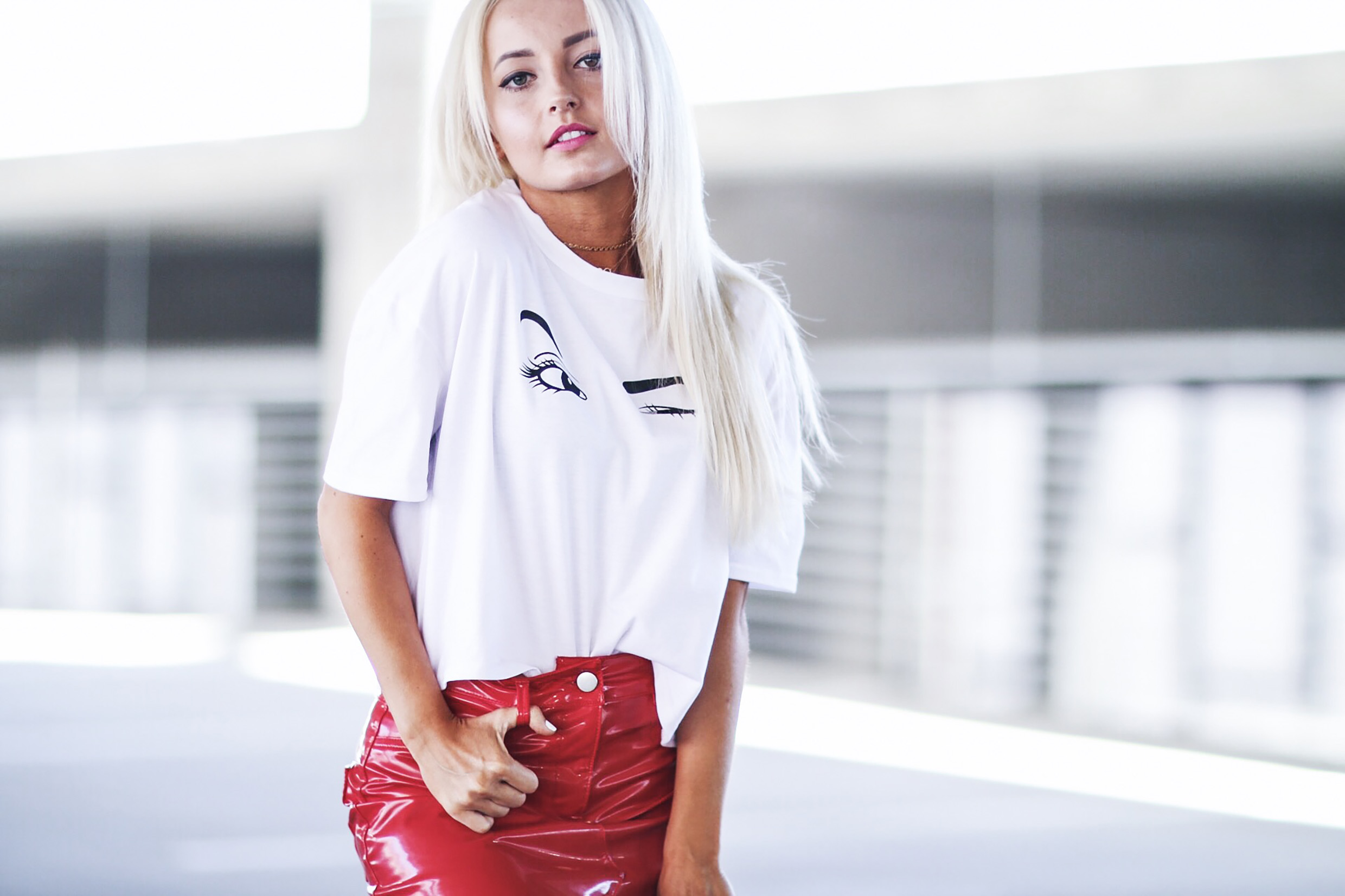 Alena Gidenko of modaprints.com styles a faux leather red skirt with a fun tee shirt