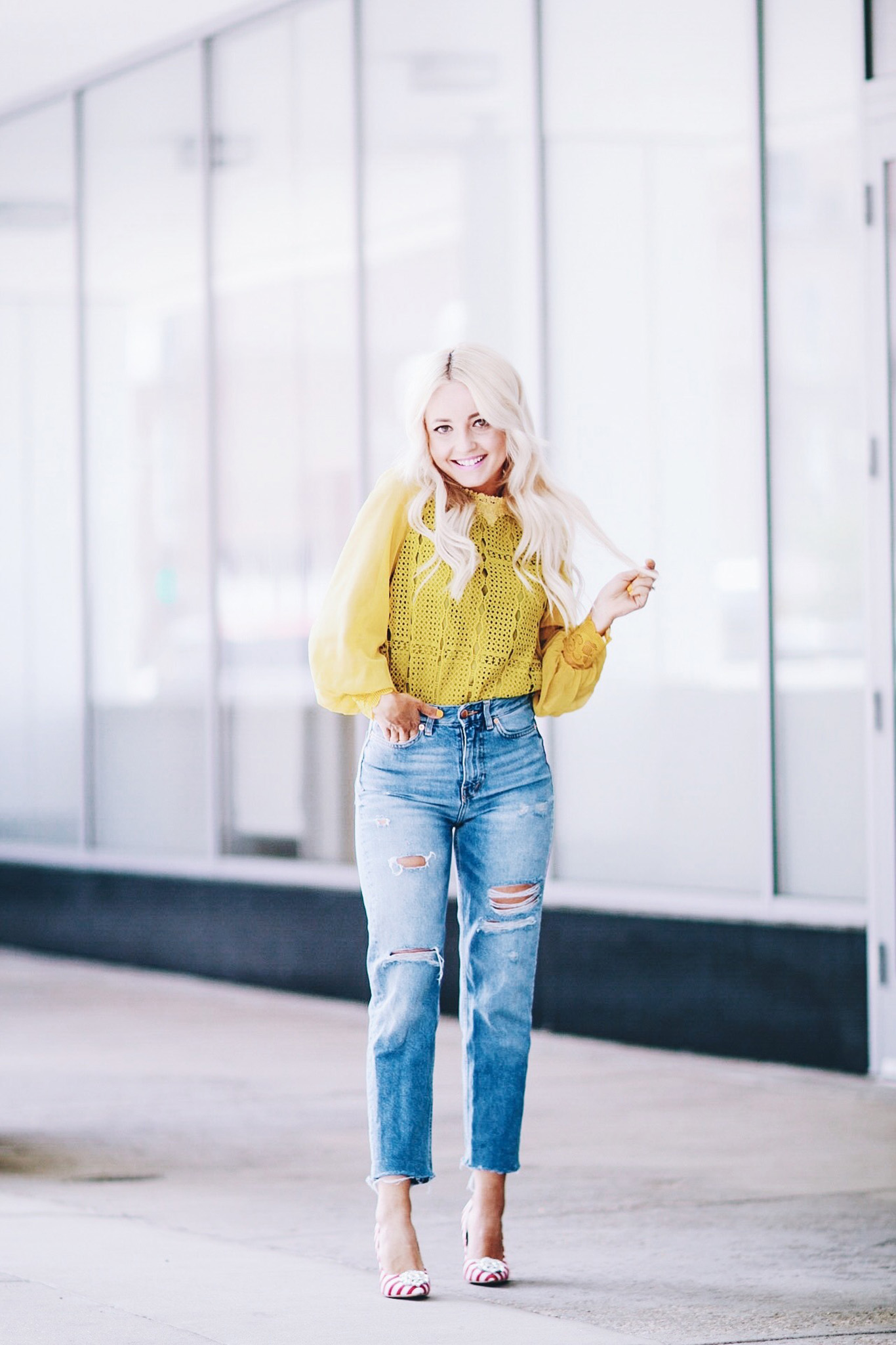 Alena Gidenko of modaprints.com styles a yellow lace top with high waisted mom jeans