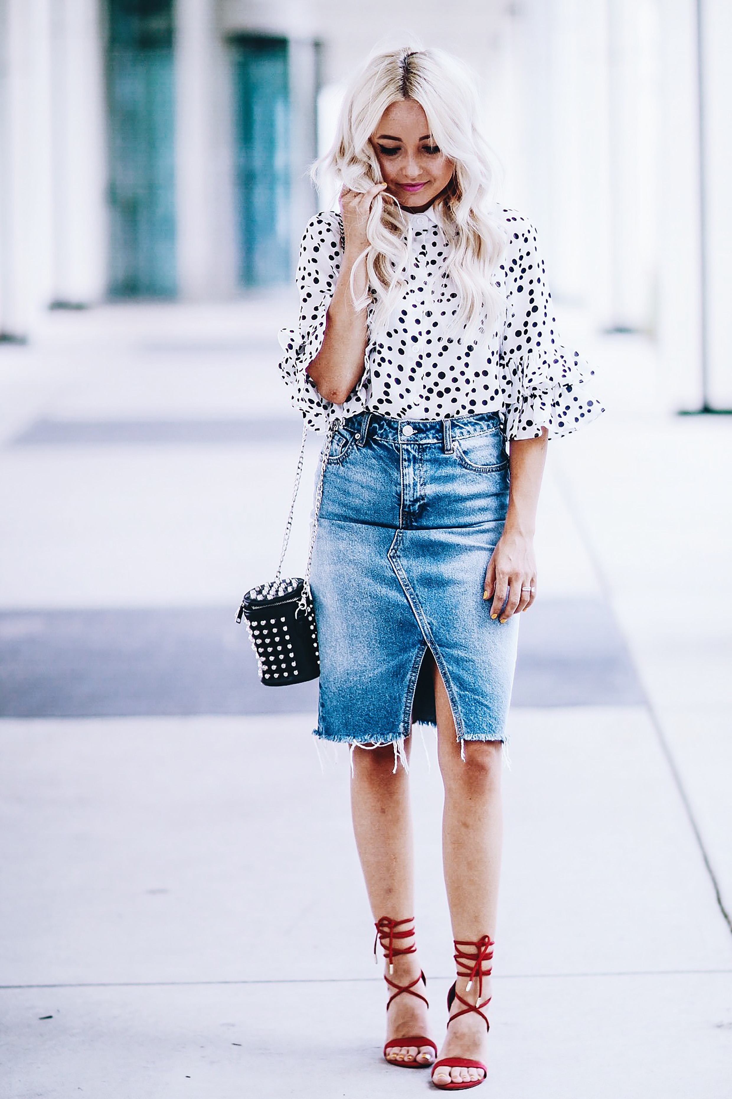 Alena Gidenko of modaprints.com styles a denim pencil skirt with a polka dot blouse