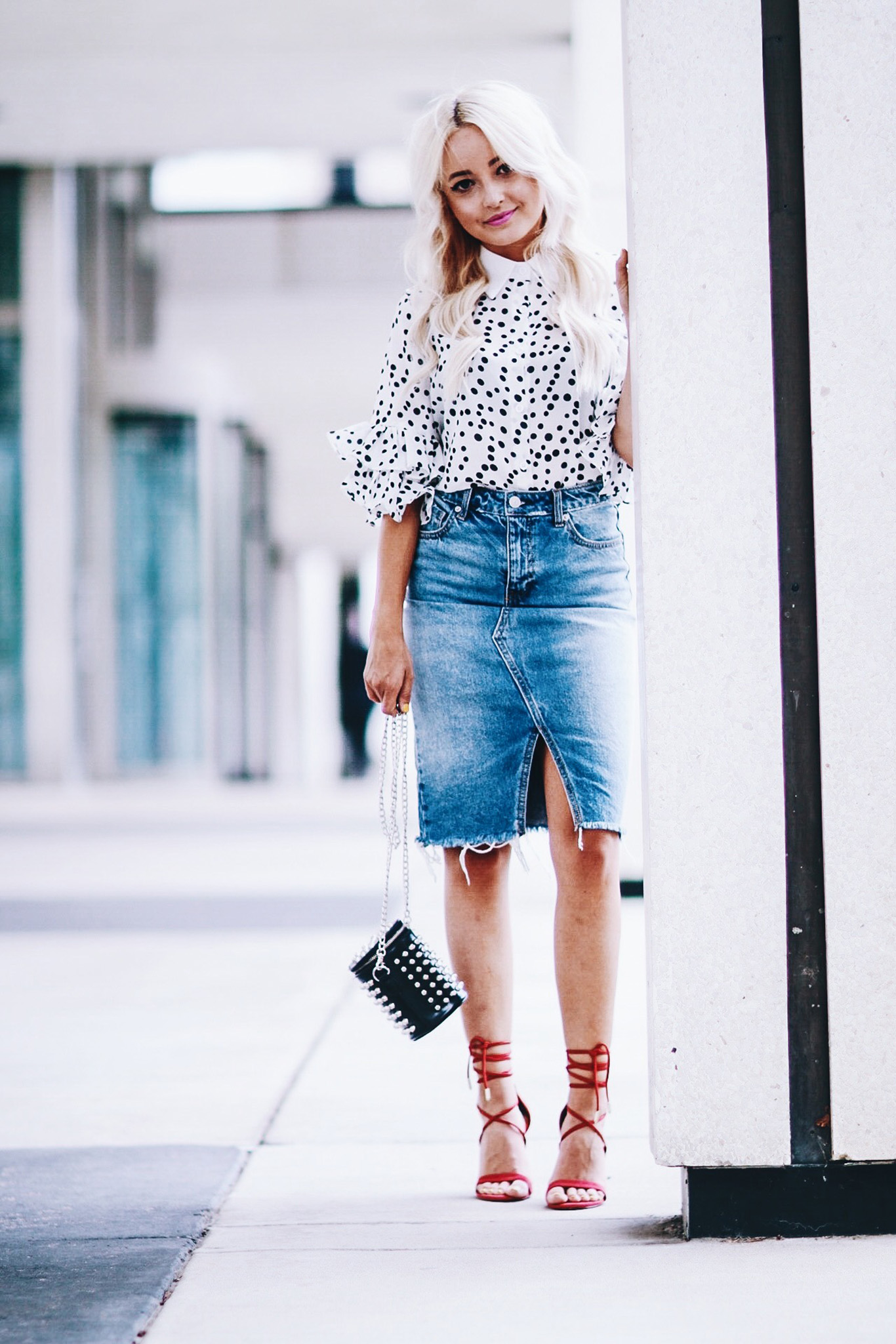 Alena Gidenko of modaprints.com styles a denim pencil skirt with a polka dot blouse