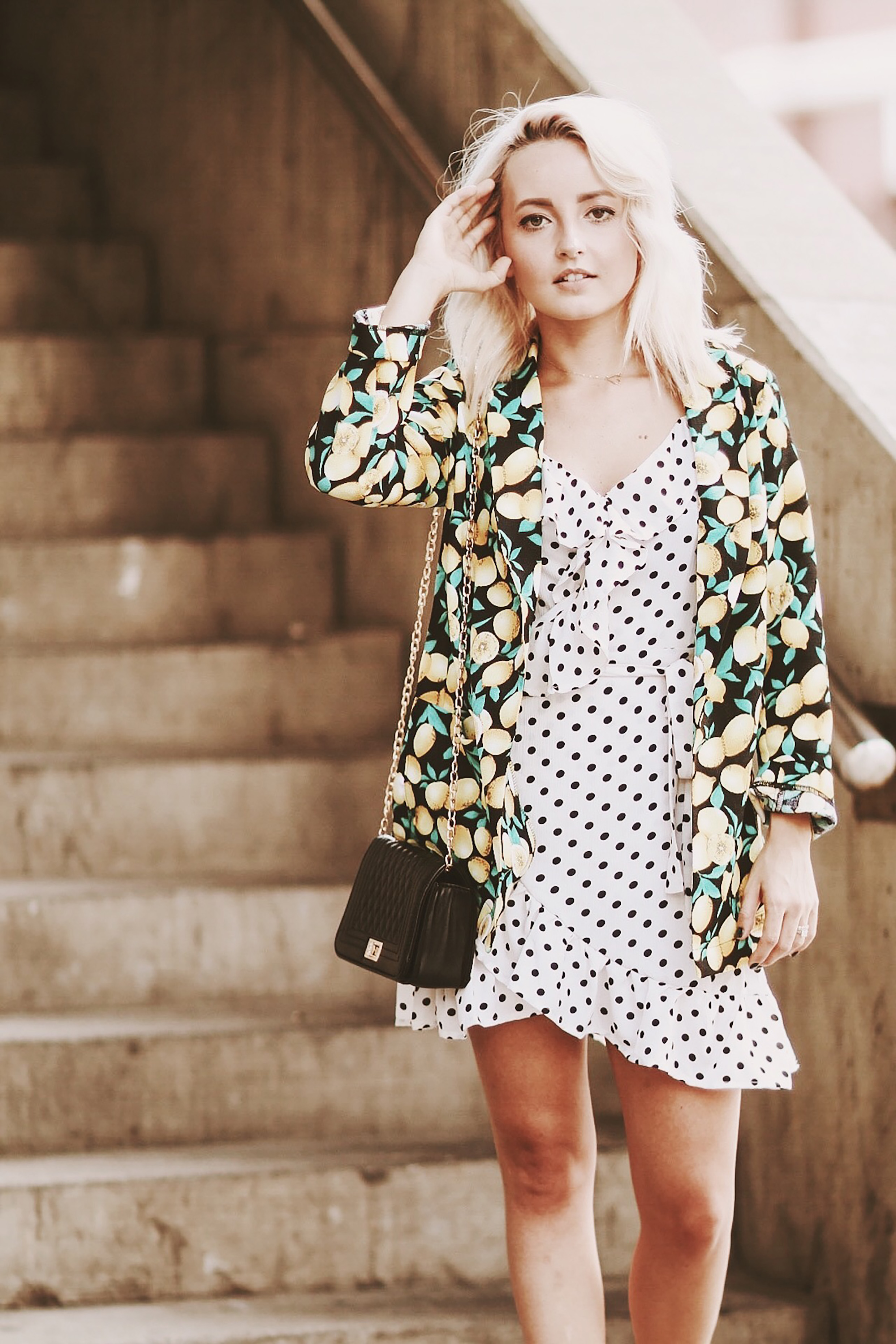 Alena Gidenko of modaprints.com styles her Summer polka dot dress with a lemon blazer for Fall