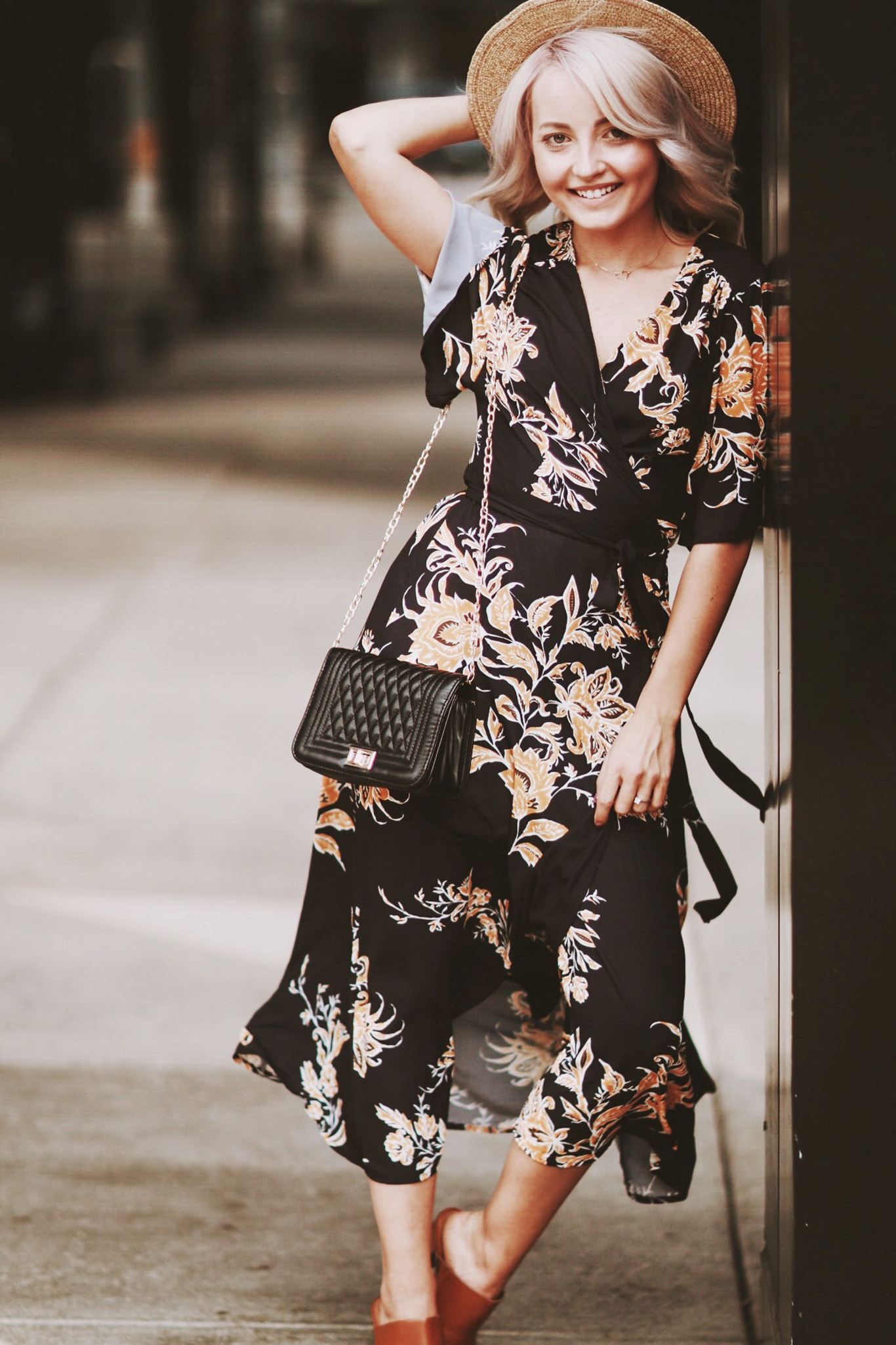 Alena Gidenko of modaprints.com styles a maxi floral dress with dark brown mules for Summer