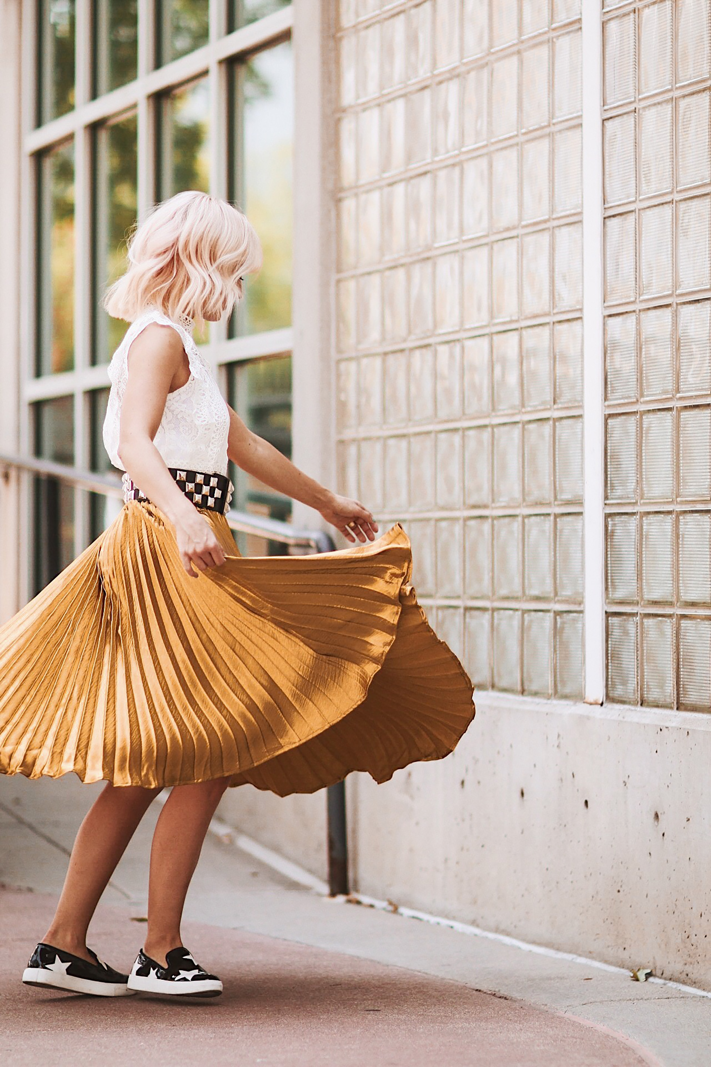 Alena Gidenko of modaprints.com styles a gold pleated skirt with a lace top for Fall