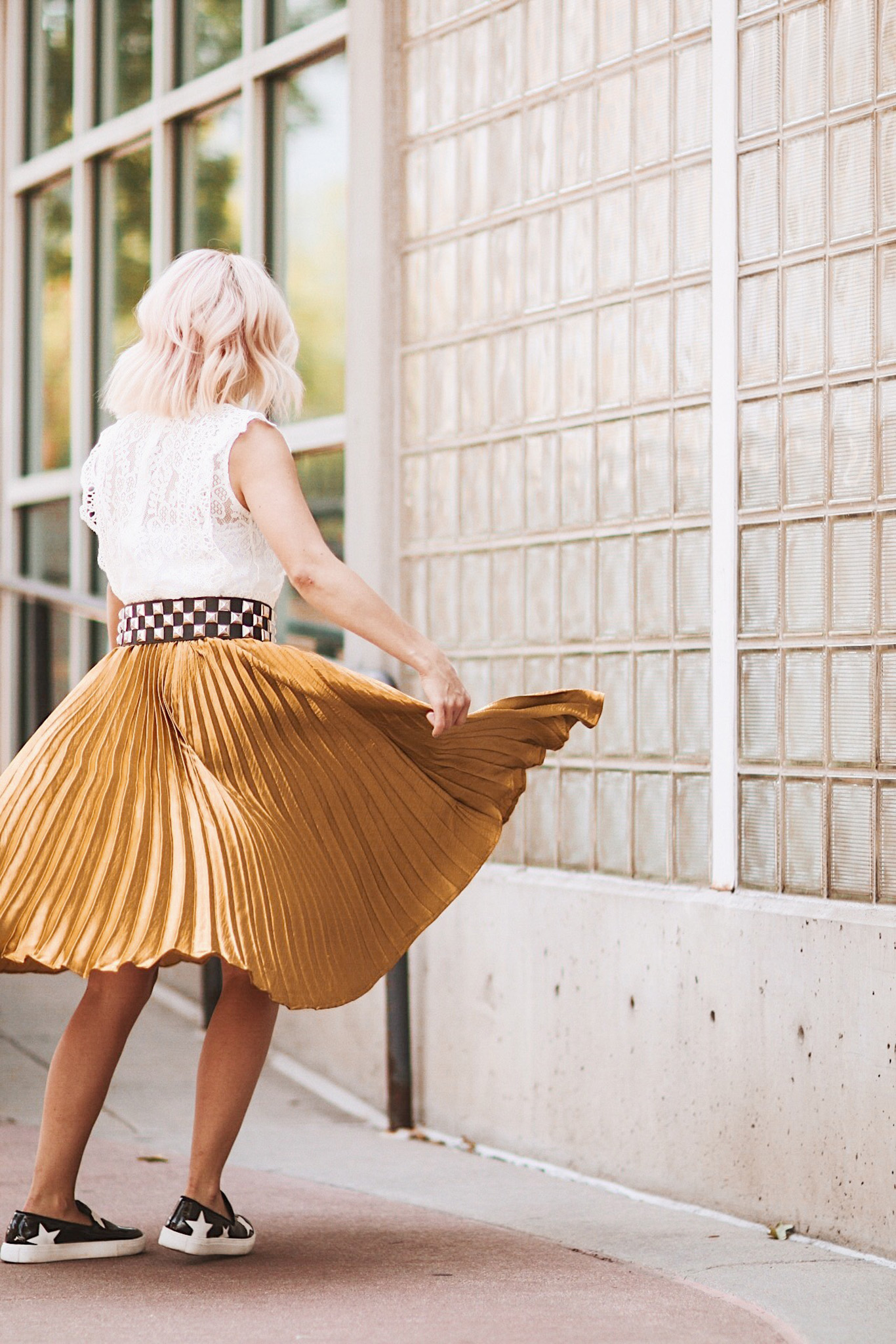 Alena Gidenko of modaprints.com styles a gold pleated skirt with a lace top for Fall